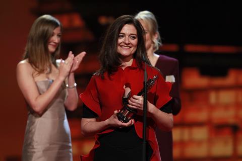 Lars von Trier's wife Bengt Froge accepts the best film honours on his behalf